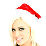 Pic of Skinny shaved teen Kacey Jordan in red christmas hat gets her tiny pussy stuffed