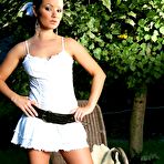 Pic of Brunette Jana Mrazkova strips her garments in the garden and masturbates wearing only leather belt.