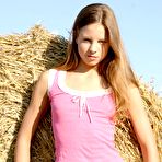 Pic of Skinny teen babe Belinda Nubiles strips her garments by the haystack and shows her tiny tits.