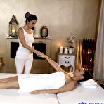 Pic of 
      Claudia Bavel and Foxxi Black pleasure each other on top of the massage table
    