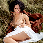 Pic of Curly-haired brunette shows her exotic nude body in the haystack - aMetart.com