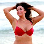 Pic of Lisa Appleton flashes her nipples on a beach in Spain