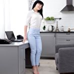 Pic of Office brunette kneels in front of her colleague to take cum on her boobs