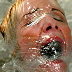Pic of Sierra Sinn gets smothered in a big glass tank with water after rope bondage