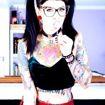 Pic of Tattooed Necro Nicki in pigtails & short skirt on knees showing tight ass - PornPics.com