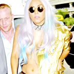Pic of Lady Gaga in stockings and bra in airport paparazzi shots