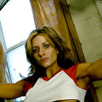 Pic of Muscle girl Danielle Rouleau does exercises in the gym room flashing her big firm tits