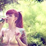 Pic of Smoldering hot redhead Ivy Jean shows off her inked body in the garden all naked and sexy