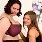 Pic of Naughty lesbian BBW having fun with a teeny babe