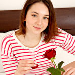 Pic of This teen loves to make her solo adventures romantic with flowers and the proper setting that helps her ease into masturbation. gallery