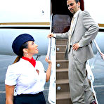 Pic of Aimee Addison and another sexy dressed stewardess share a hard meaty cock