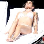 Pic of Katie Waissel sunbathing in white bikini