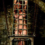 Pic of Sasha Monet is helpless in cage when Chanta Rose dunks her in vertical water tank