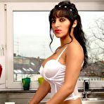 Pic of A perfect gypsy bitch in white wedding stockings and noble big breasts posing in the kitchen and drink coffee
