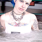 Pic of Naked alt girl Rachel Face lets you read her tattoos and shows her pierced parts in jacuzzi
