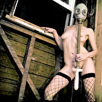 Pic of Pierced Soma Stardust in fishnet stockings and gas mask dildo fucks her cunt