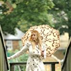Pic of Sapphire of Busty Brits classy and sexy with a raincoat and umbrella