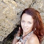 Pic of Smoldering hot redhead teen girl Korica A poses at the beach and exposes her teen charms