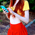 Pic of Sherice Pale Redhead in a Red Miniskirt