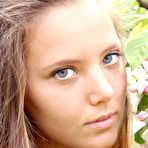 Pic of Insanely beautiful blonde teen babe Mango A poses outside in an orchard
