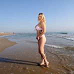 Pic of BikiniFanatics - Curvy blonde beach babe loves to flash her boobs