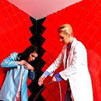 Pic of Brunette Mila Dark dressed in pink gets showered by blonde haired lady doctor