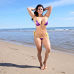 Pic of BikiniFanatics - Busty bikini model loves topless on the beach