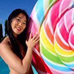 Pic of BikiniFanatics - Tight Japanese micro bikini model and her lollypop