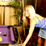 Pic of Horny blonde Phoenix strips and plays with balls on the purple pool table