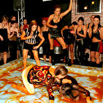 Pic of Two clothed messy wrestlers Mila Dark and Lucy Cornet have fun in front of female audience
