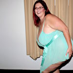 Pic of Four-eyed fattie Peaches Larue poses in lingerie and takes interracial breast cumshot