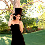 Pic of Aidra Fox Aidra Fox takes off her fancy gown and top hat as she poses outside.