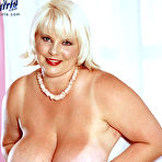 Pic of White-haired fattie June Kelly touches her gigantic tits and takes metal dildo in her pussy