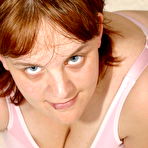Pic of Plumper mama exposed her monster breasts on white carpet