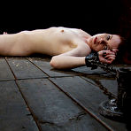 Pic of Tight red-haired slave girl Lilla Katt gets spreadeagled on the floor and tickled.