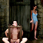 Pic of Shy Love dressed in blue nightie humiliates her slave Mini in the dungeon