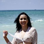 Pic of BikiniFanatics - Latina bikini model spreads on the beach