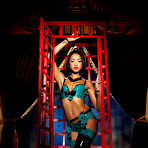 Pic of Skin Diamond Black woman takes off her sexy lingerie in a red cage.
