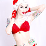 Pic of White haired goth model Razor Candi in red Christmas lingerie shows off her tits
