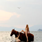 Pic of Naked Slender Lesbian Friends Dariya A And Lera B Ride The Horse Naked Together At The Seaside / DefineBabe.com