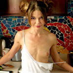 Pic of Cute little girl Nedda poses naked in the kitchen with a teasing smile on her face