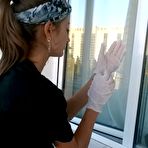 Pic of Gorgeous girl showing her nice ass while cleaning the window 15 photos