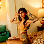 Pic of Dallas E Maxwell exposes her inked body in the motel room