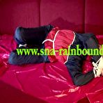 Pic of ShinyNylonArts Rain Bound | Get 2 Videos with Lucy bound and gagged enjoying her shiny nylon Rainwear from our 2021 Archive