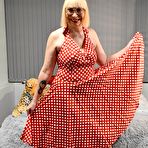 Pic of English Milf wearing a Red Polka Dot Dress takes her knickers half way down and shows off her bald wet cunt – Bare Milfs