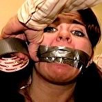 Pic of tied-and-gagged.com | 23 YR OLD REAL ESTATE BROKER IS MOUTH STUFFED WITH A SPONGE, WRAP TAPE GAGGED, GAG TALKING, RAG STUFFED IN MOUTH AND TIGHTLY HANDGAGGED  (D74-15)