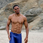 Pic of Black Muscle Man Working Out on The Beach