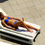 Pic of Amy Willerton sunbathing in blue bikini