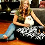 Pic of Carmen Electra posing in home with her doggies
