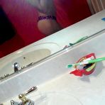 Pic of Amateur brunette hottie showing off her smoothly shaven snatch